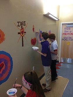 Graduating students leave their mark with in the halls of St. Marguerite School in Tooele